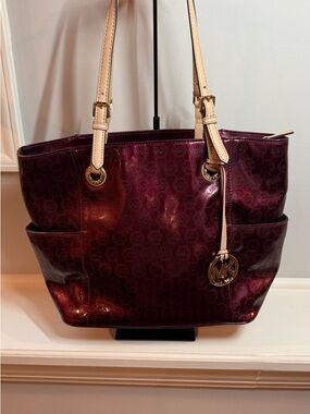 Michael Kors Jet Set East West Signature Tote in a Bordeaux patent finish